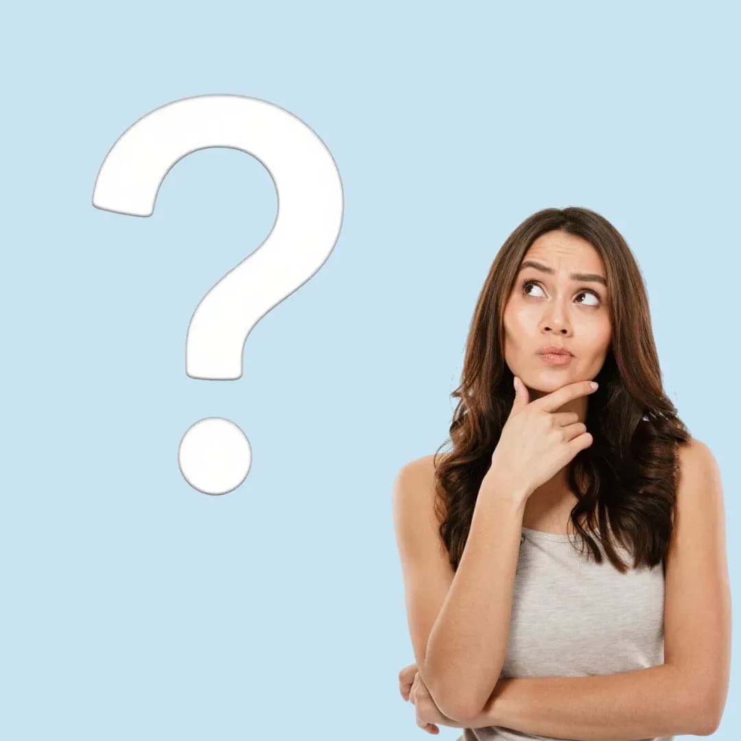 Woman in a gray tank top looking thoughtful with her hand on her chin, standing beside a large question mark on a light blue background.